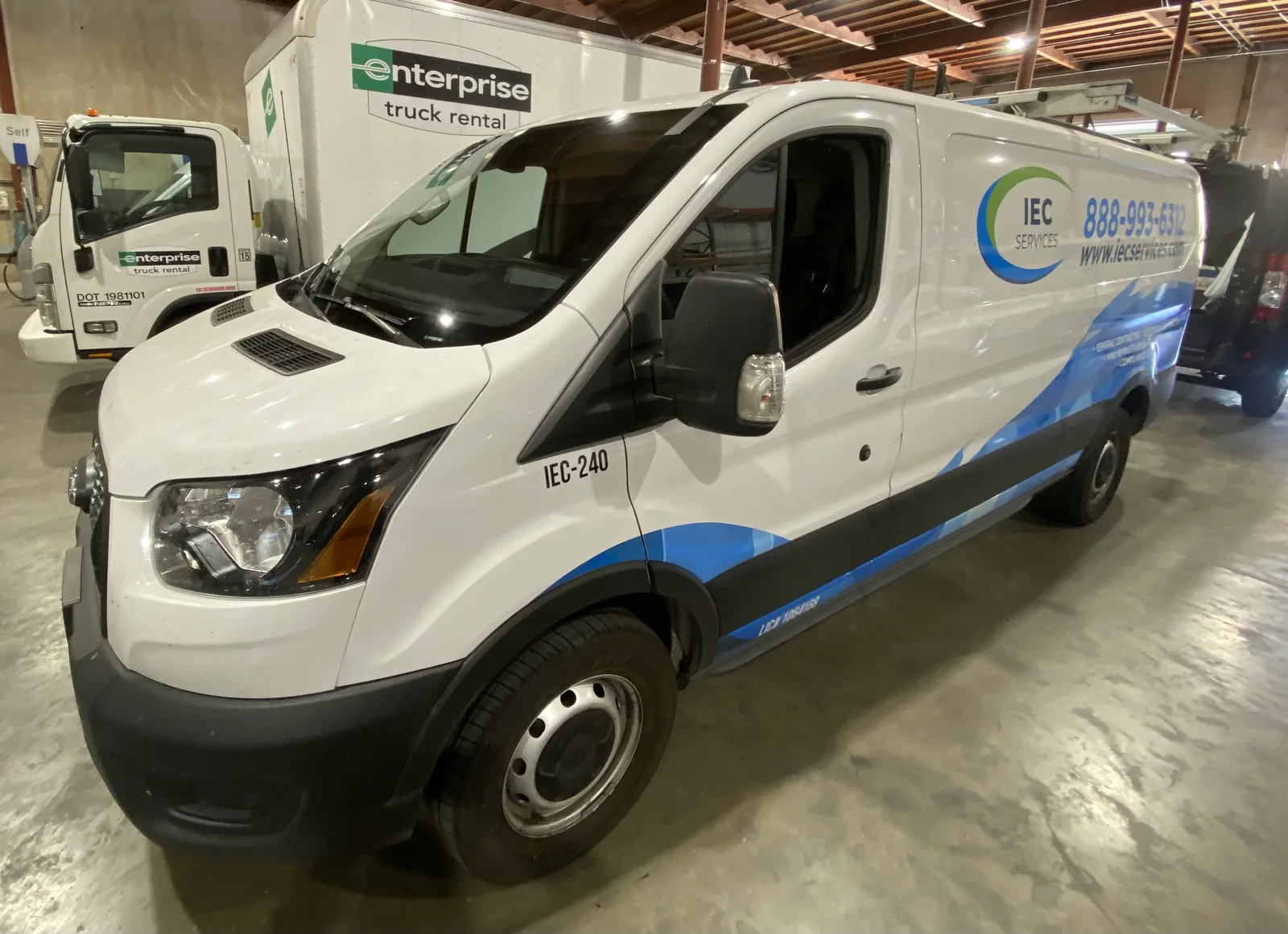 IEC Services Ford Transit van at the Very Smooth Auto Glass shop in Lincoln, CA