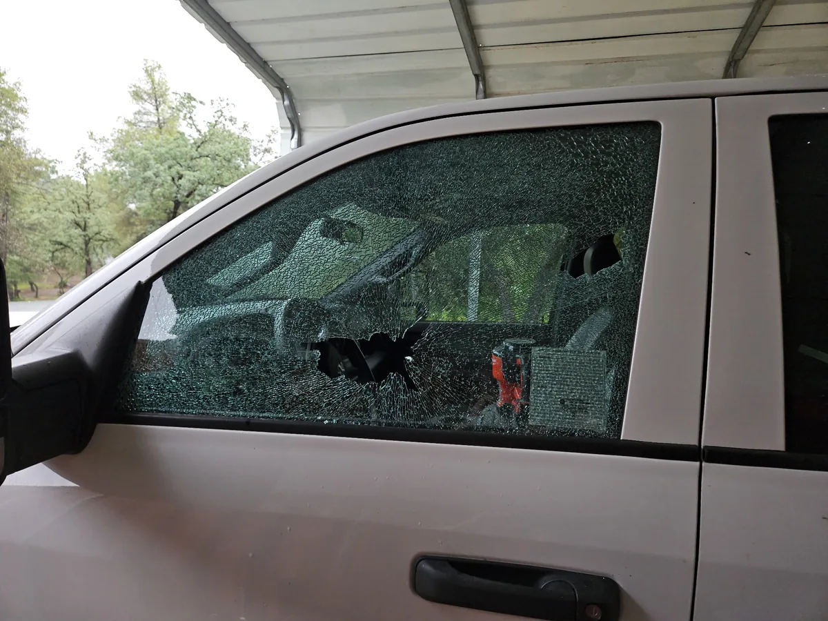 Shattered driver-side door glass on a truck before mobile side window replacement in Lincoln, CA