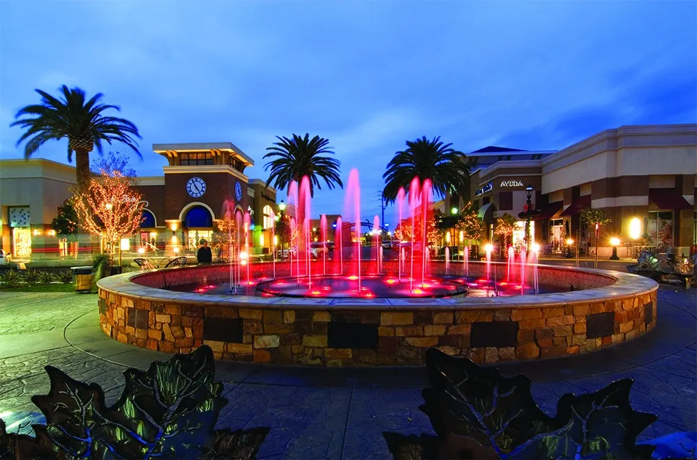 The Fountains at Roseville lit up at night — shopping and dining district in Roseville, CA
