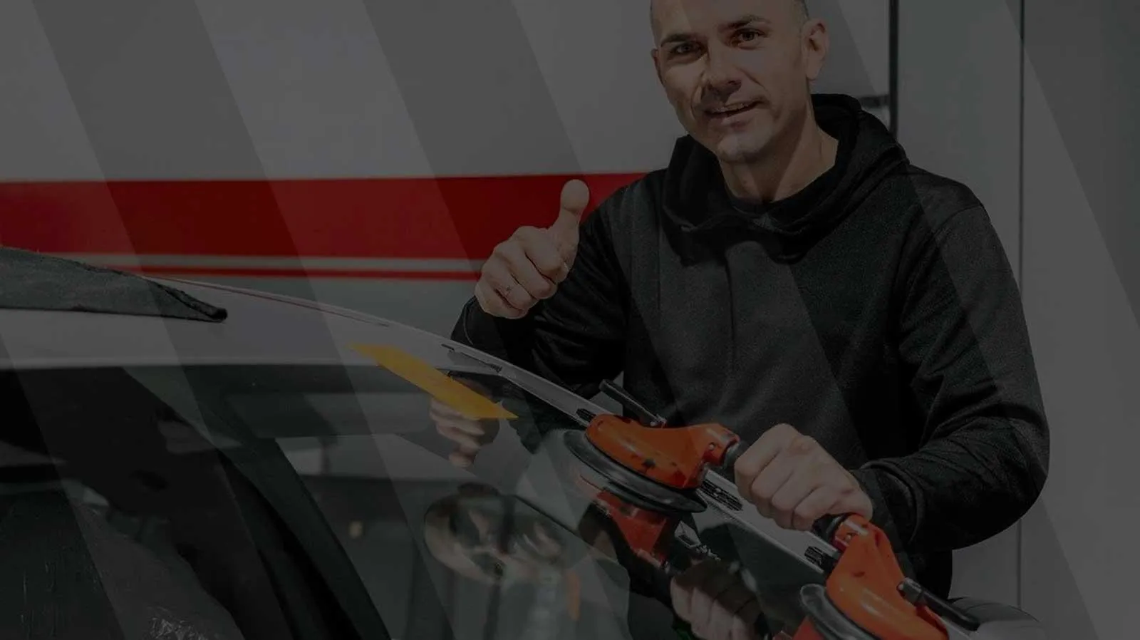 Certified technician setting OEE glass during a windshield installation in Roseville CA