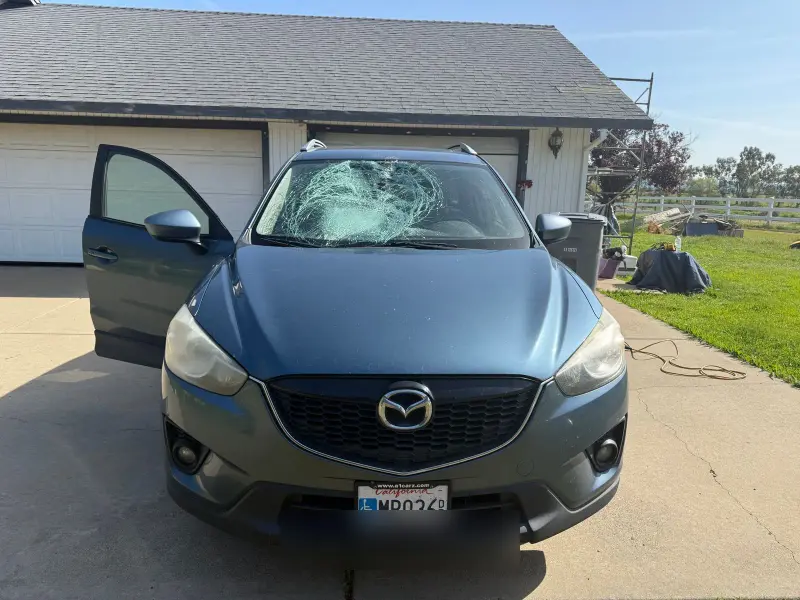 Mazda windshield damage before replacement